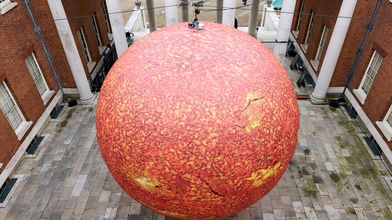Luke Jerram's Helios viewed from above, in the portico at Osterley Park and House
